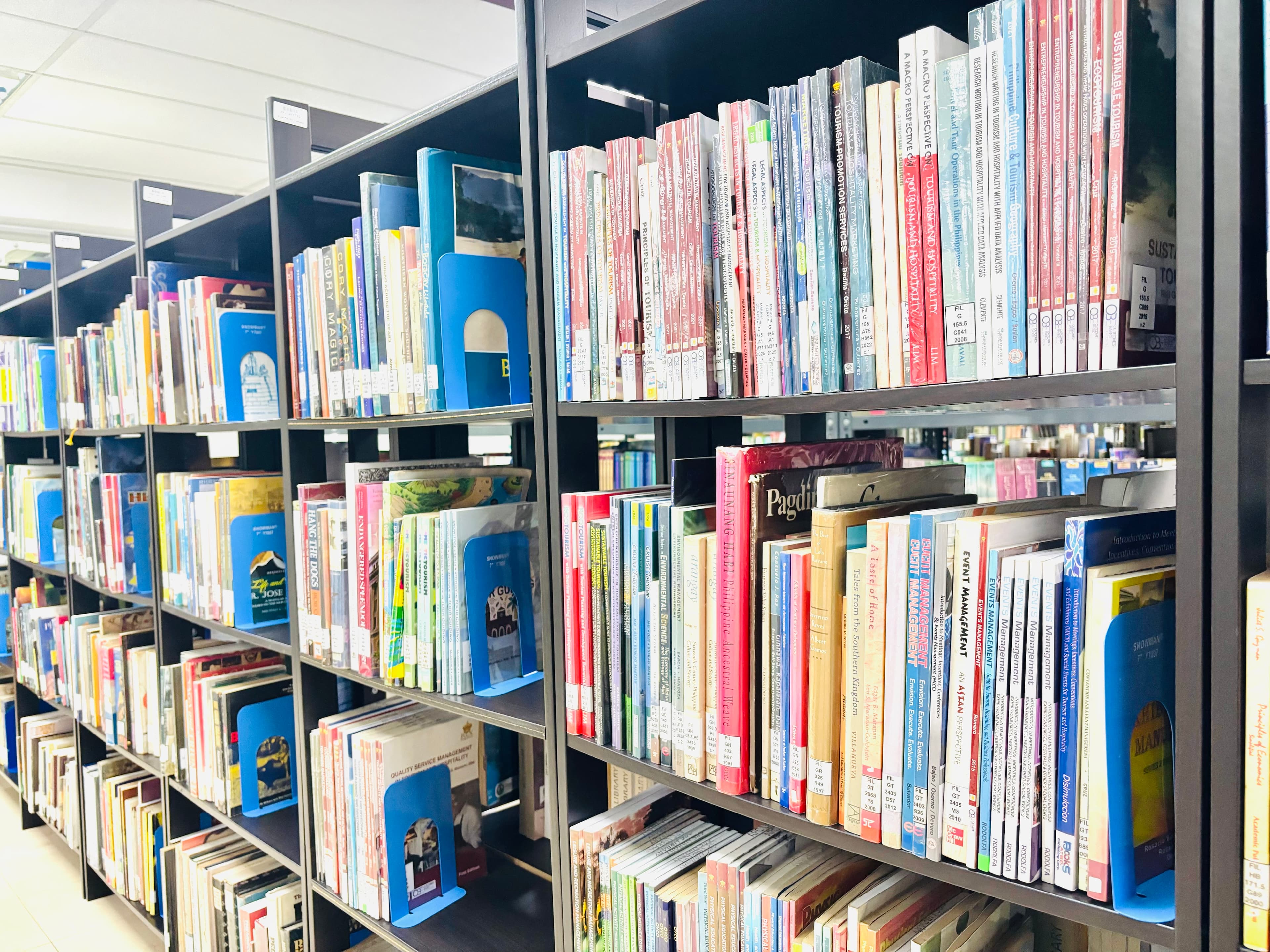 Library shelves with books for research and study